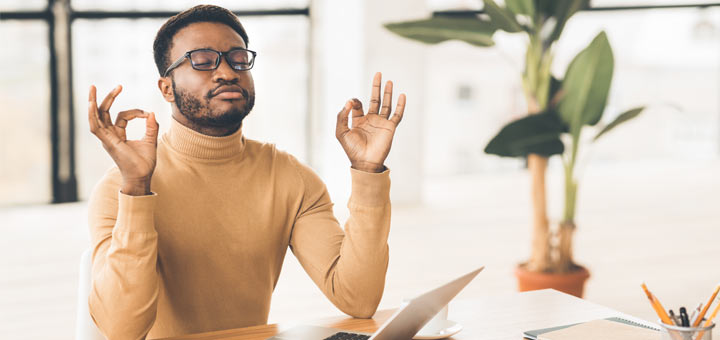 black-man-meditating-in-office
