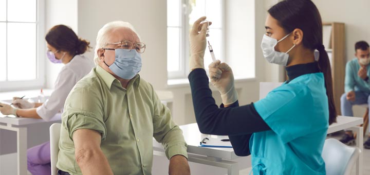 Why You Should Wear A Mask After Getting The COVID-19 Vaccine