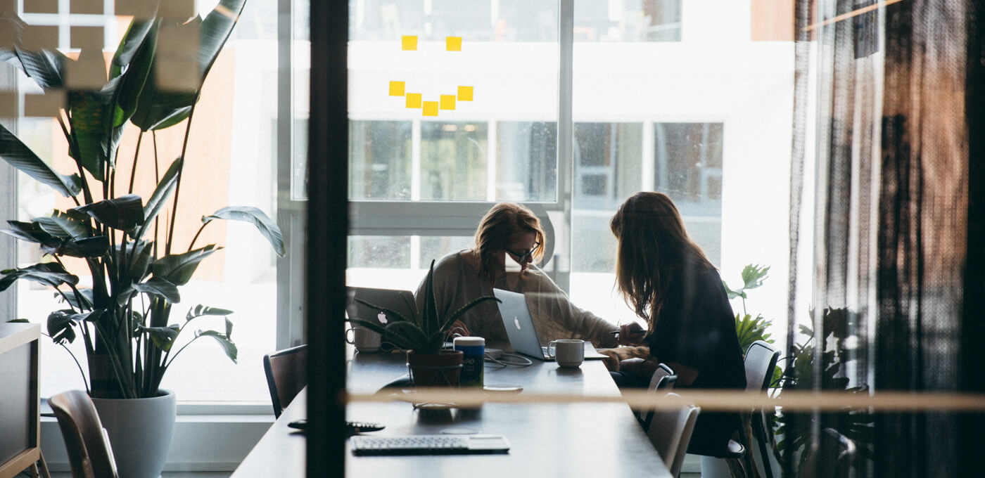 Two women collaborating at Insturment's conference room