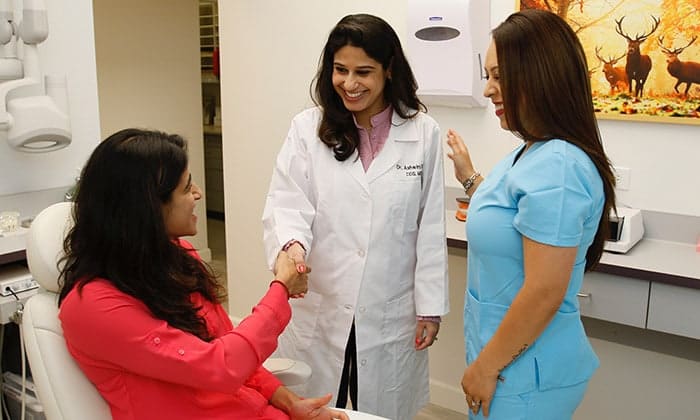 Staff introducing patient to doctor