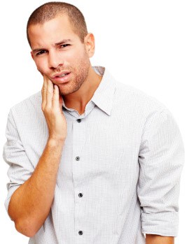 Man holding his cheek in discomfort