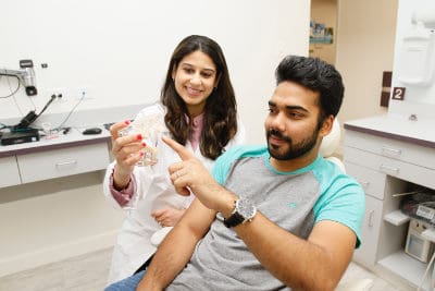 Doctor showing patient Implant options