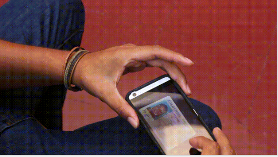 <p>A GetCalFresh client uploading documentation while applying for food assistance</p>
