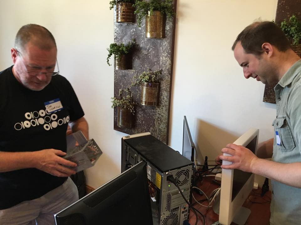 <p>Code for Asheville Volunteers repair computers that were later donated to homeless advocacy organization BeLoved.</p>