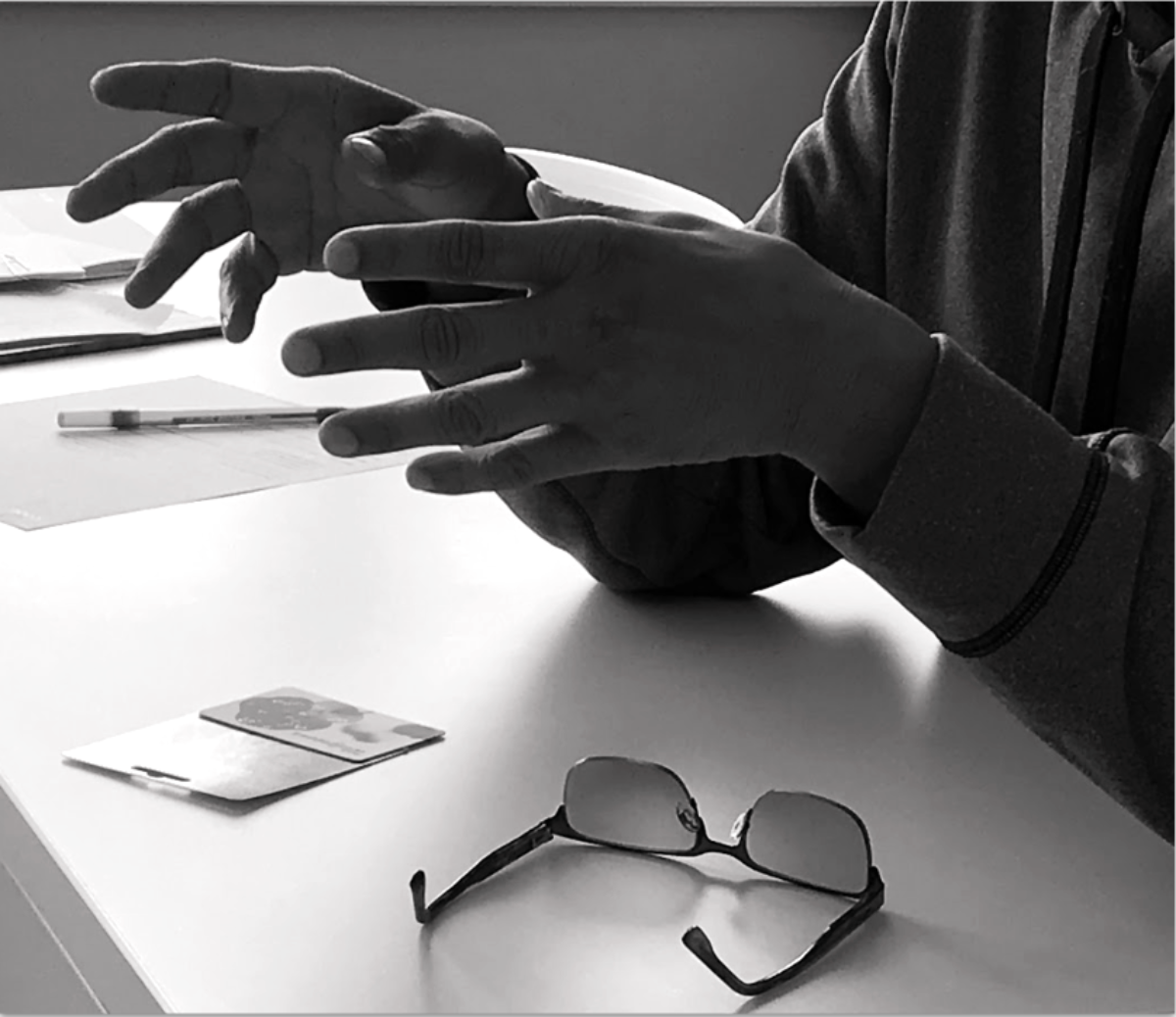 A client's hands over a table