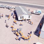 People installing a manufactured home in Arizona