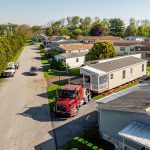 Manufactured home getting transported