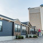 Exterior of a modern manufactured home at a housing show