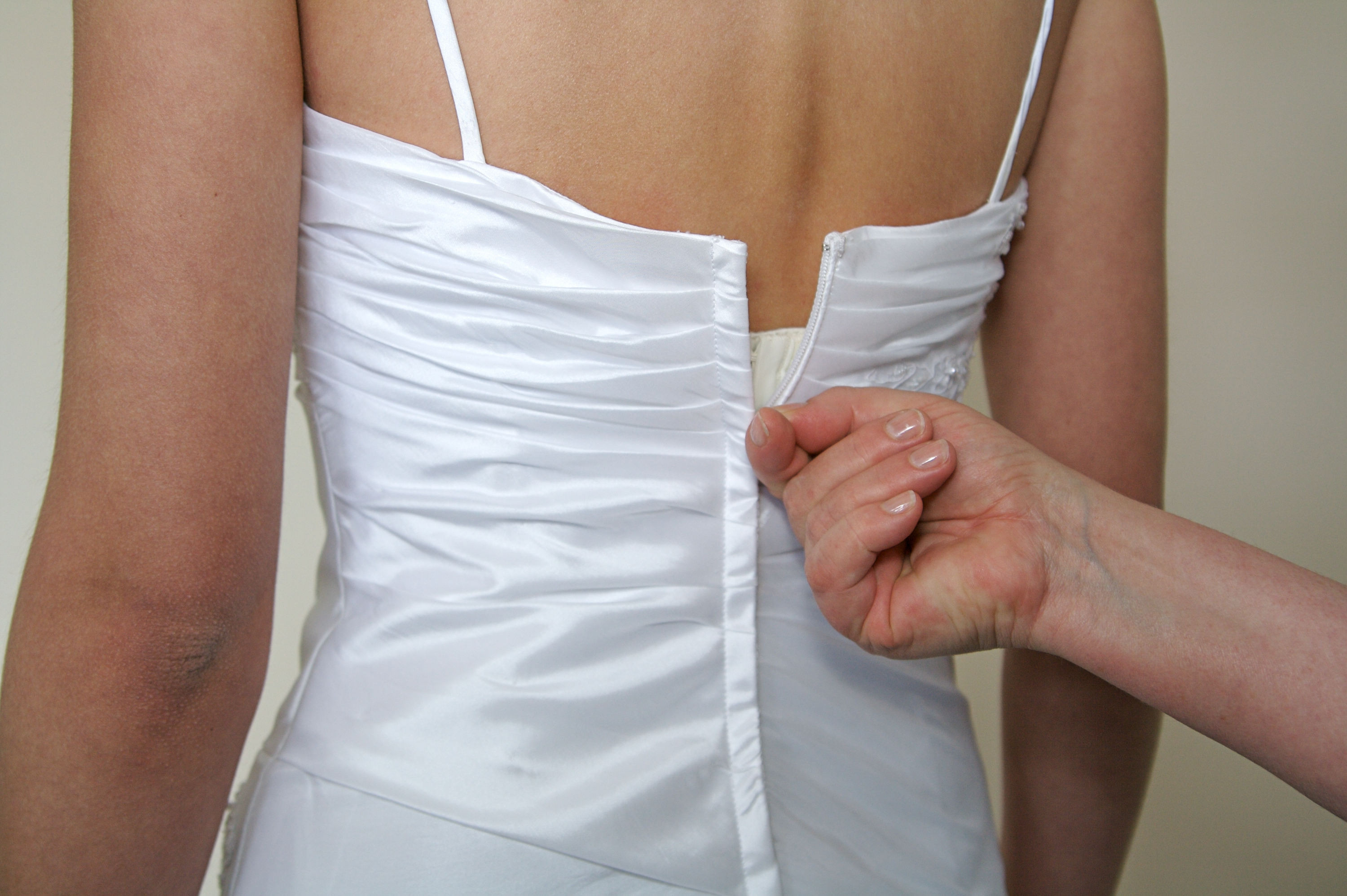 How to keep a zipper from coming undone when wearing a strapless dress -  Quora