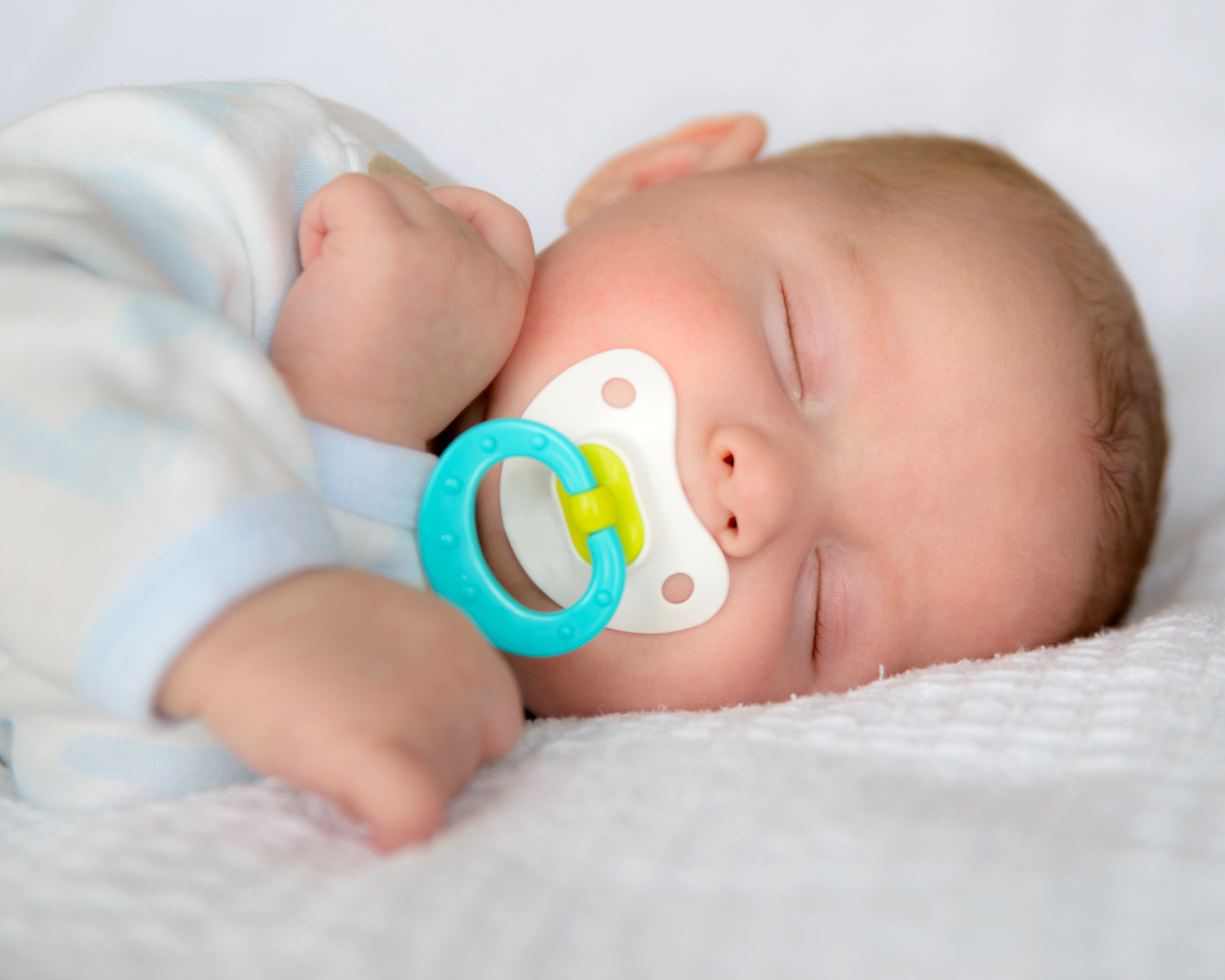 newborn sleeping with pacifier