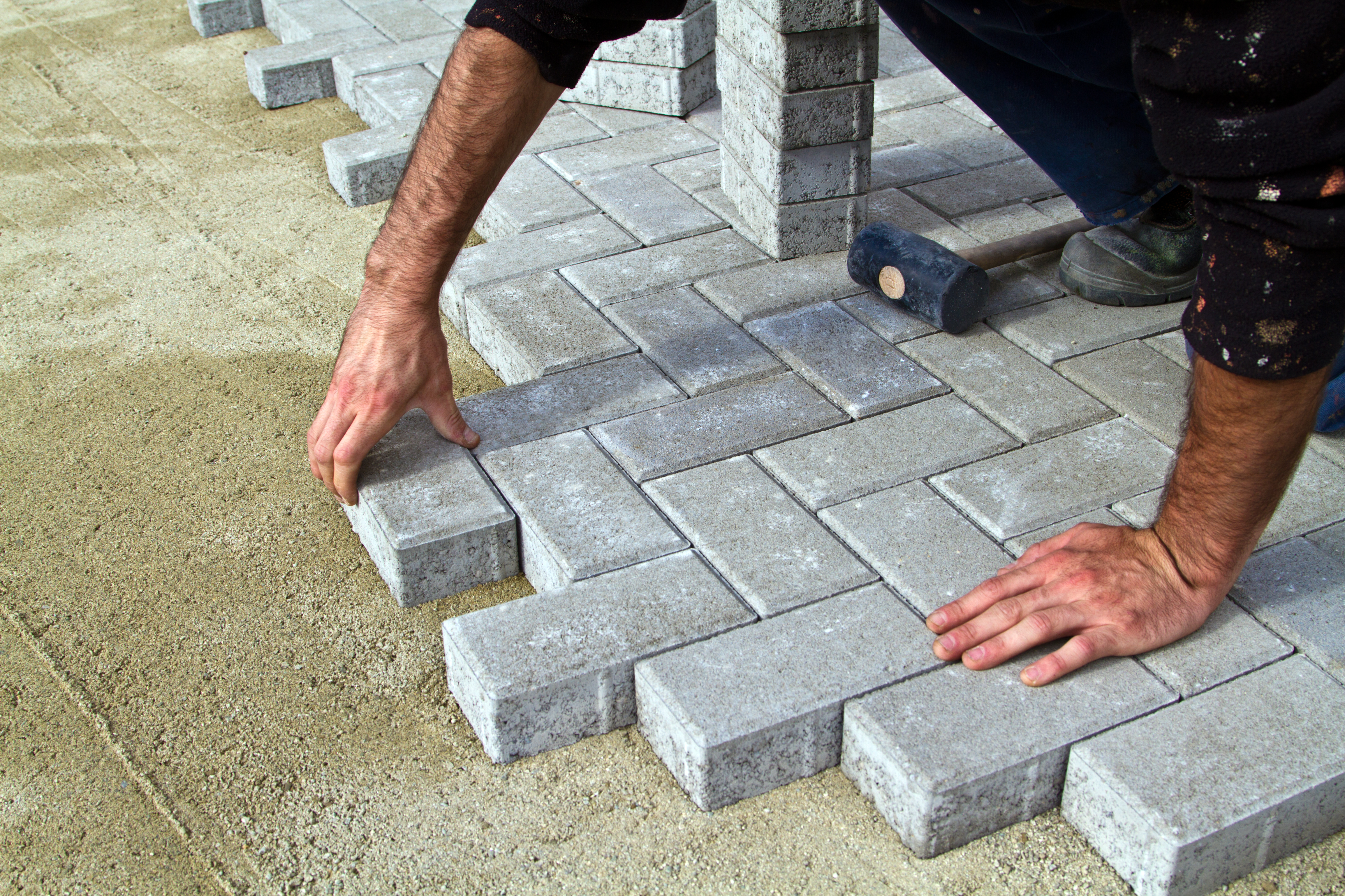 laying paving slabs on soil