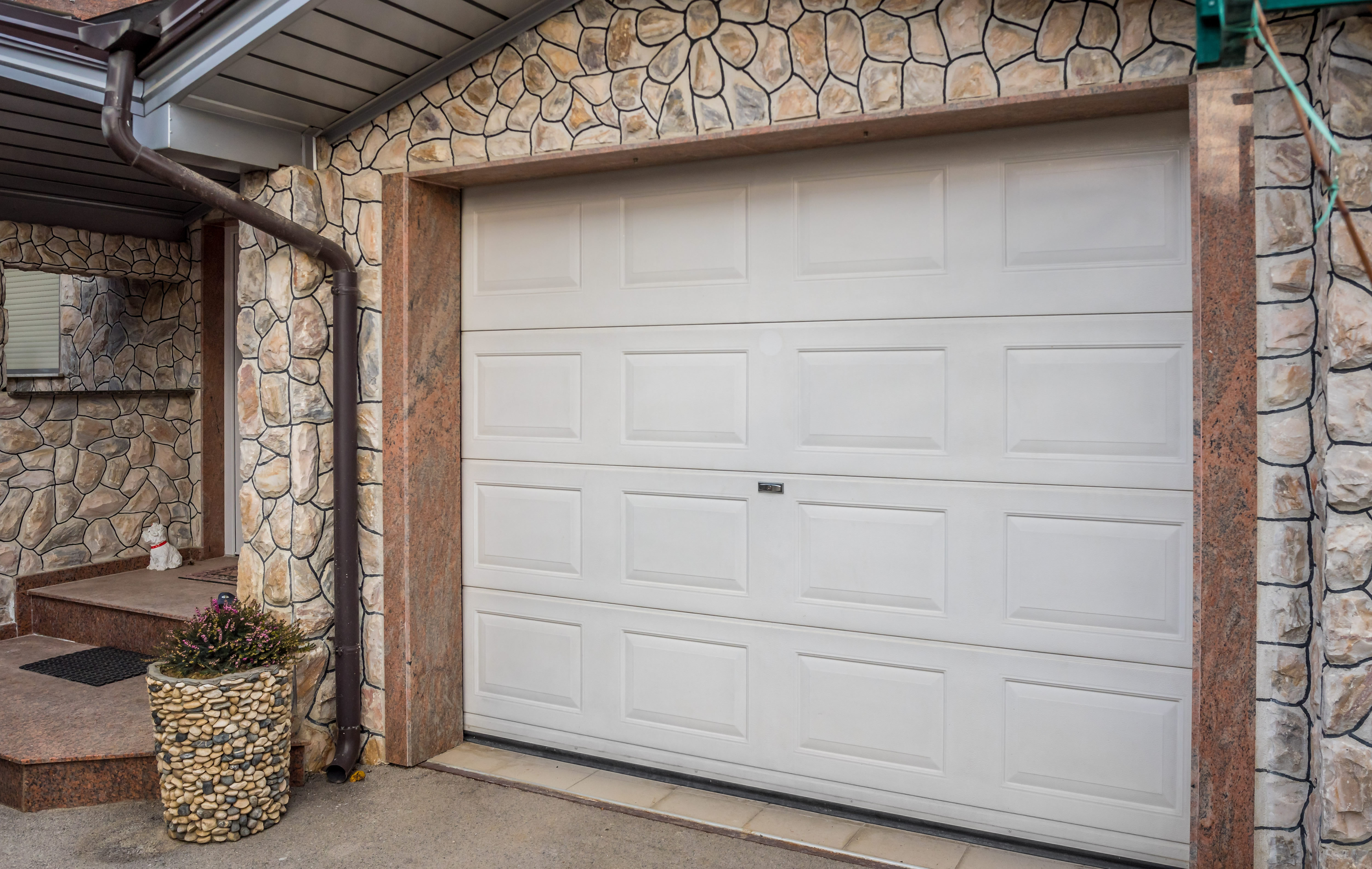 How To Fix A Garage Door That Gets Stuck Halfway Home