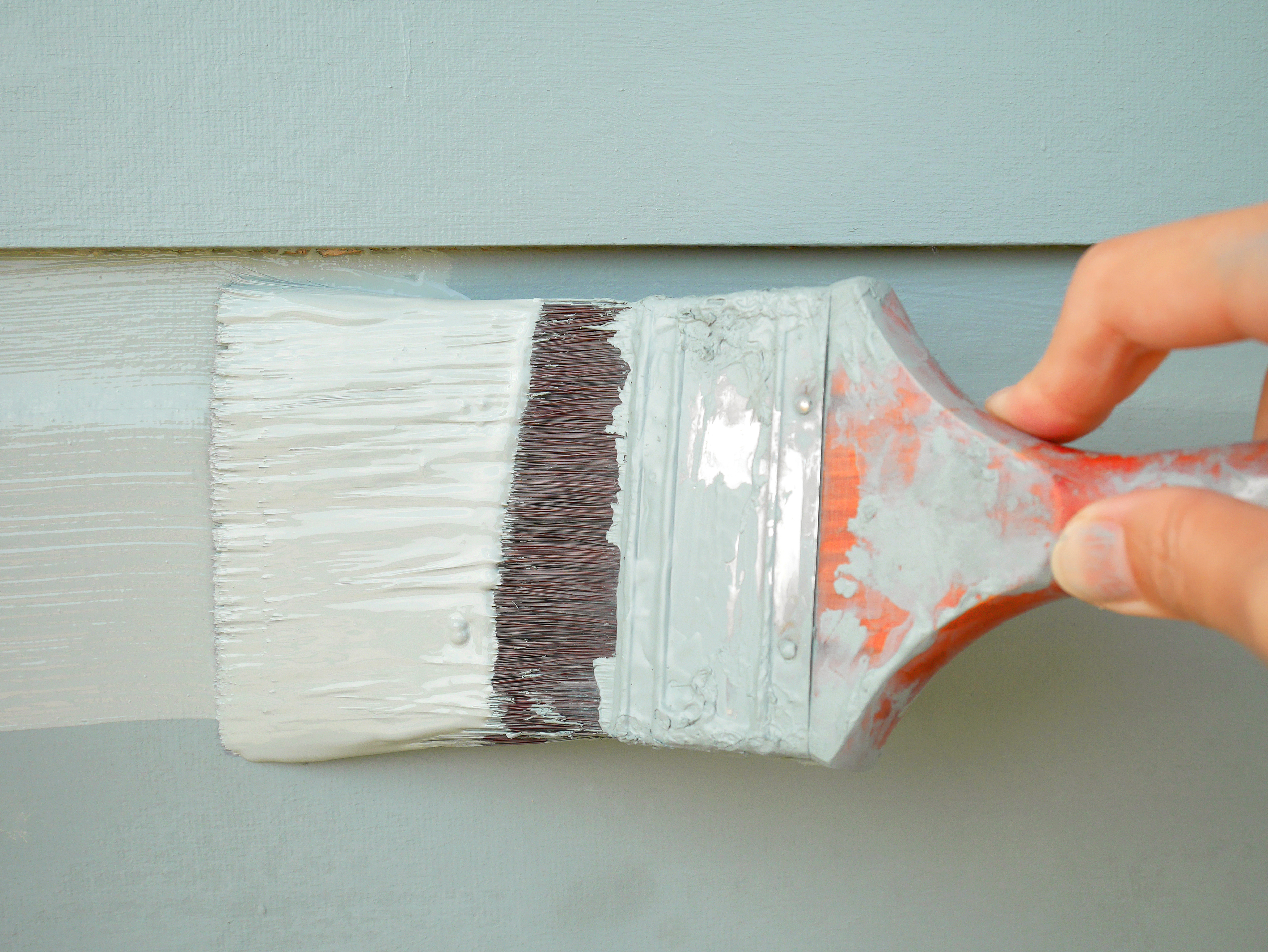 painting aluminum siding with a roller