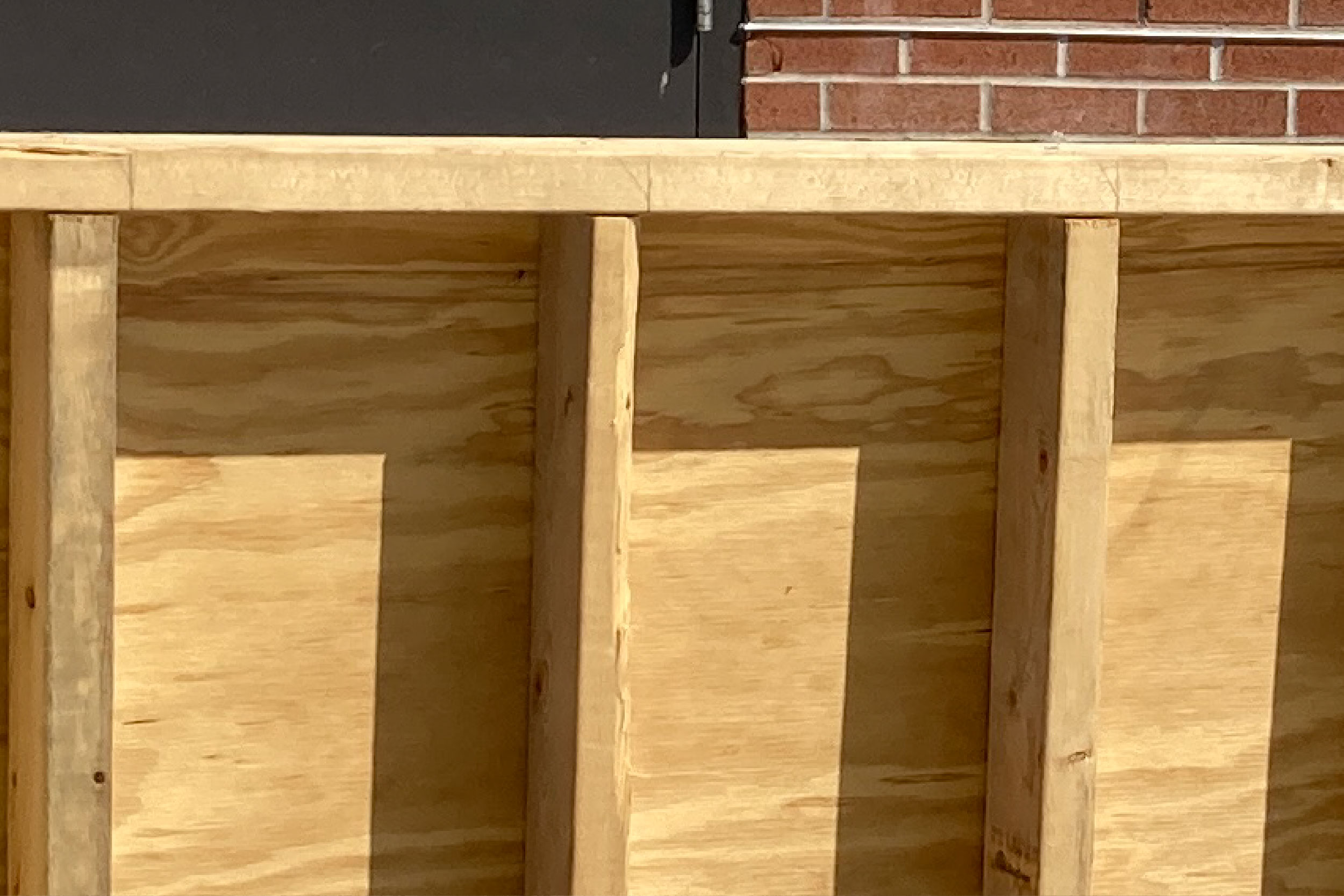 Frames are in place where crews will pour concrete for a retaining wall in front of the Chemical Building.
