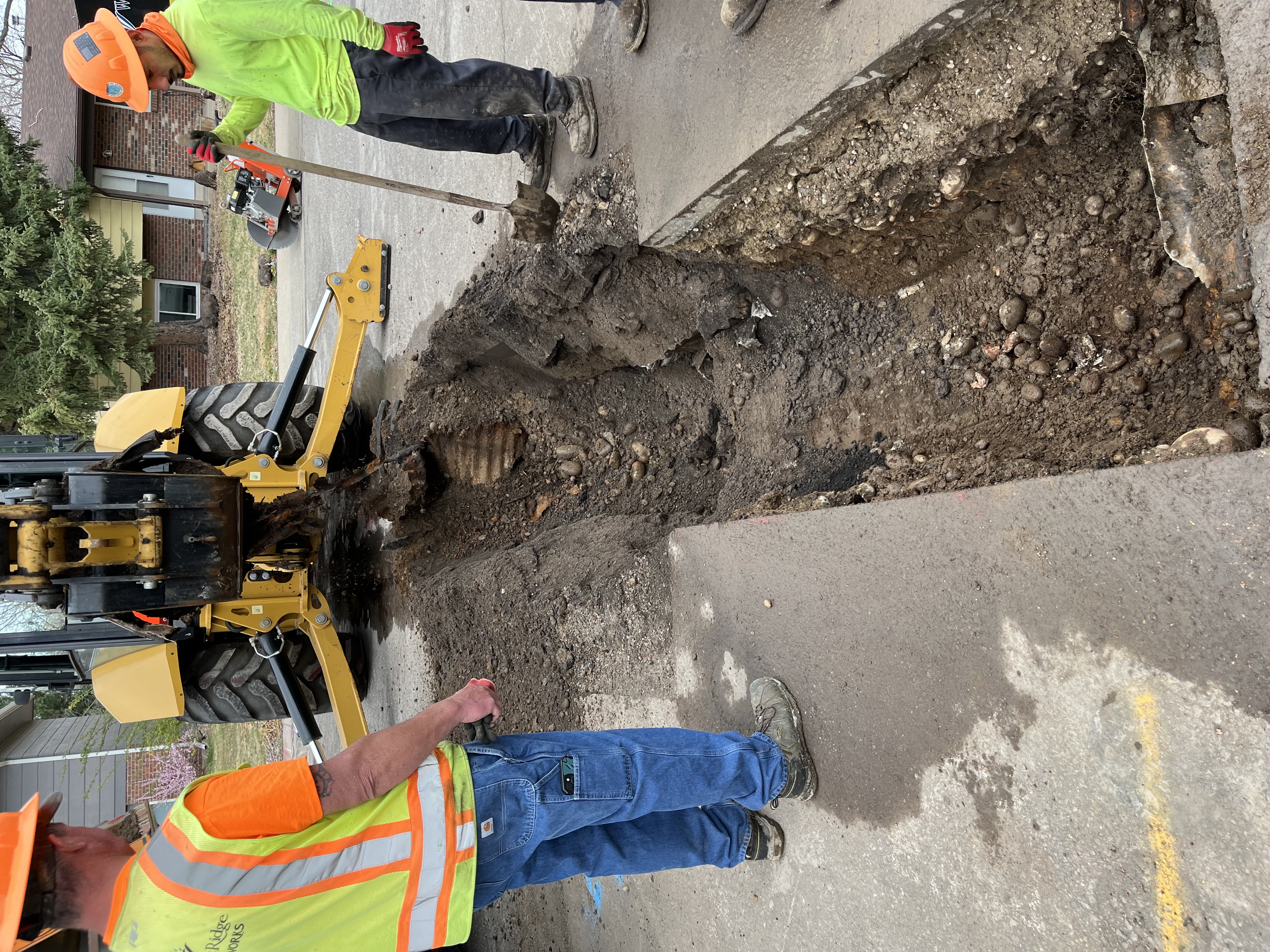 Construction crew replacing stormwater pipe