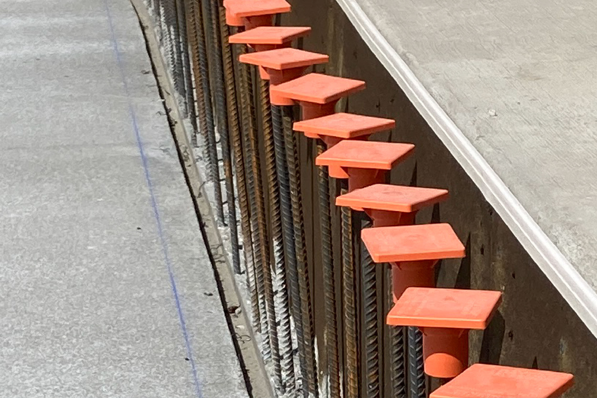 Rebar lines the way along the sidewalk in front of the Chemical Building where a retaining wall will be poured. The walkway will also be completed.
