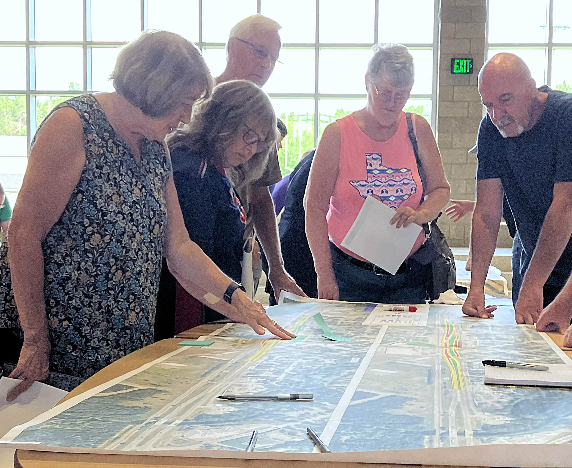 Visitors at the Public Meeting held in Royalton look at layout concepts.