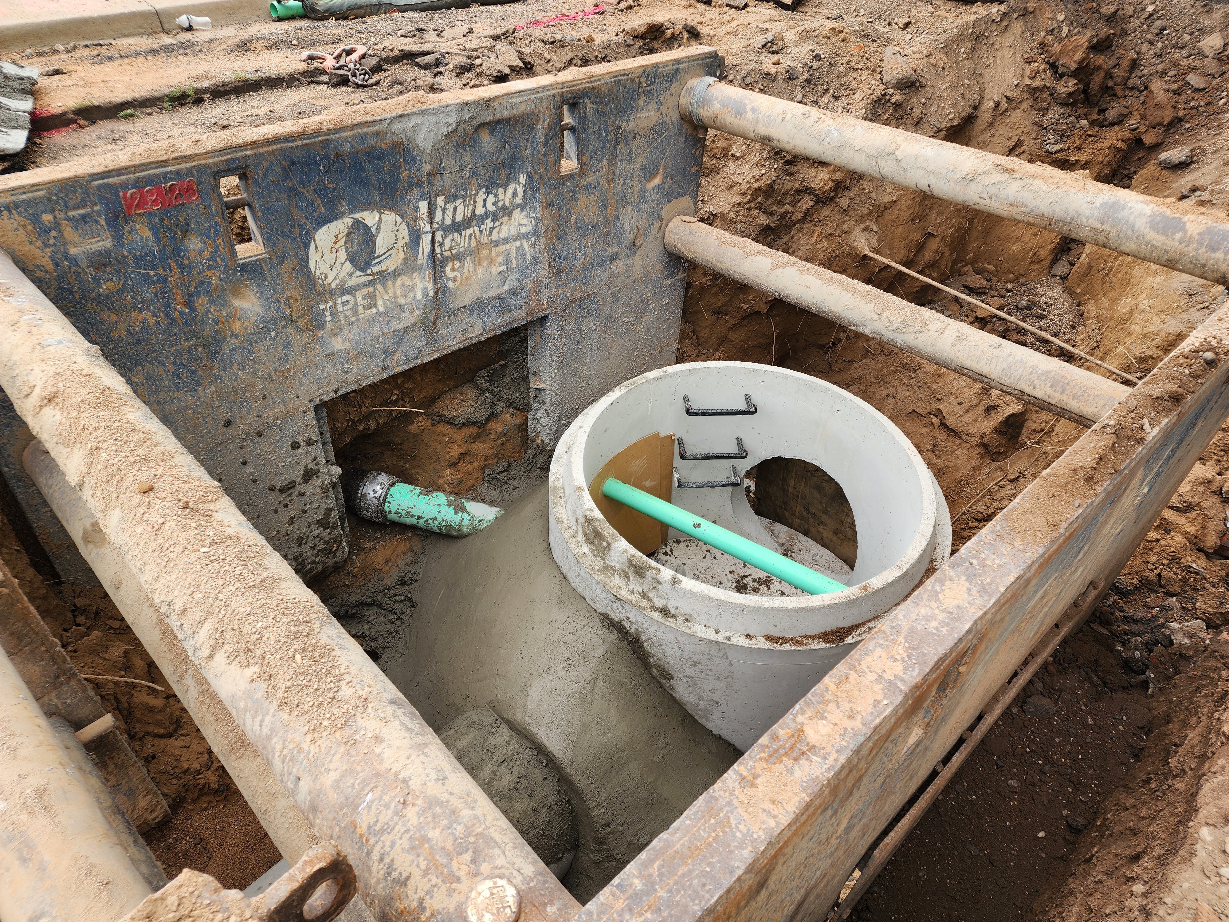 Stormwater pipe shown in large pit.