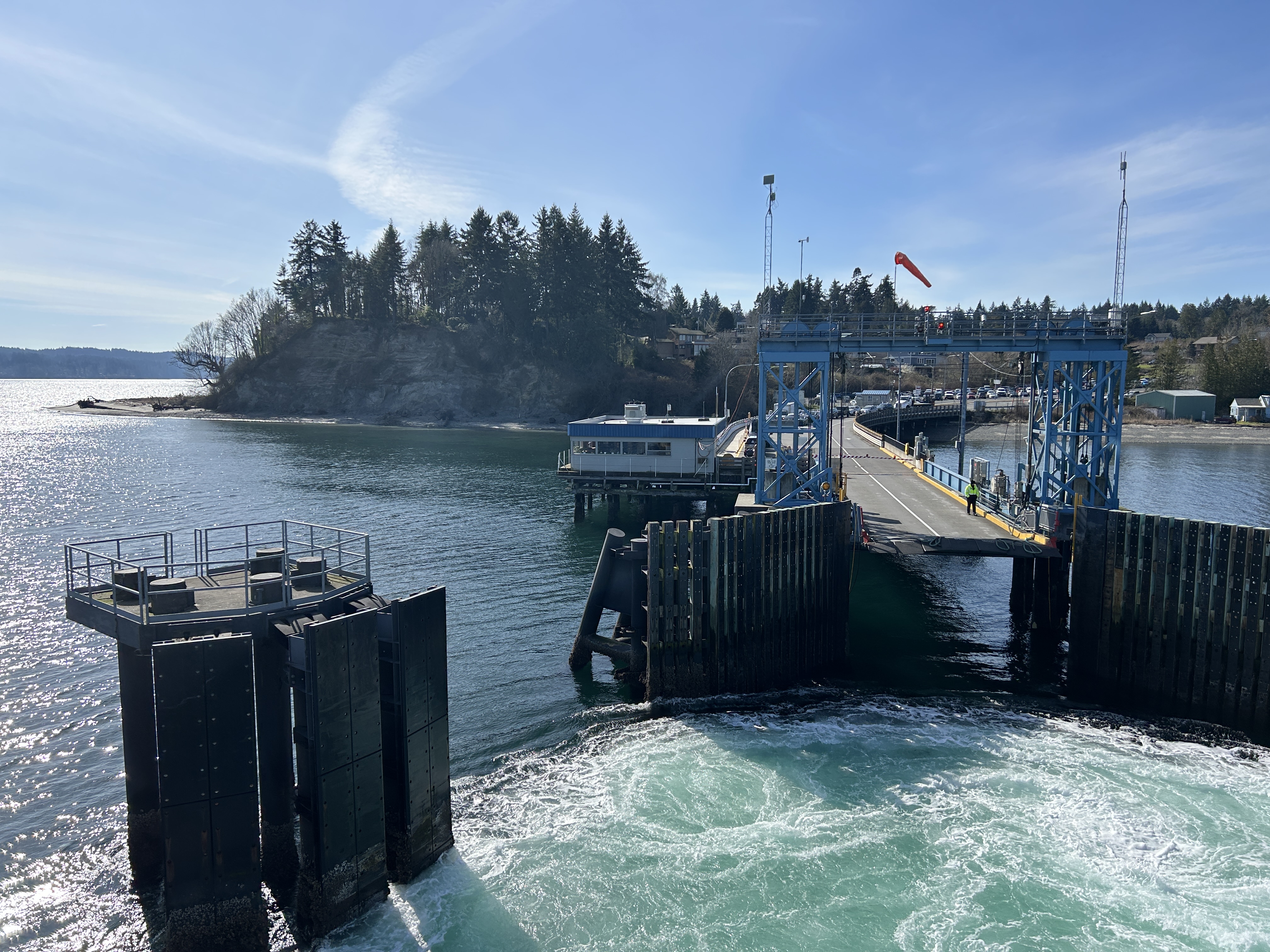 A view of the Southworth terminal, terminal building and docking structures from a departing ferry.
