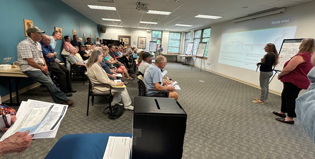 A photo of members of the public listening to MnDOT staff present at the Hwy 8 meeting at the Chisago Lakes Library. 