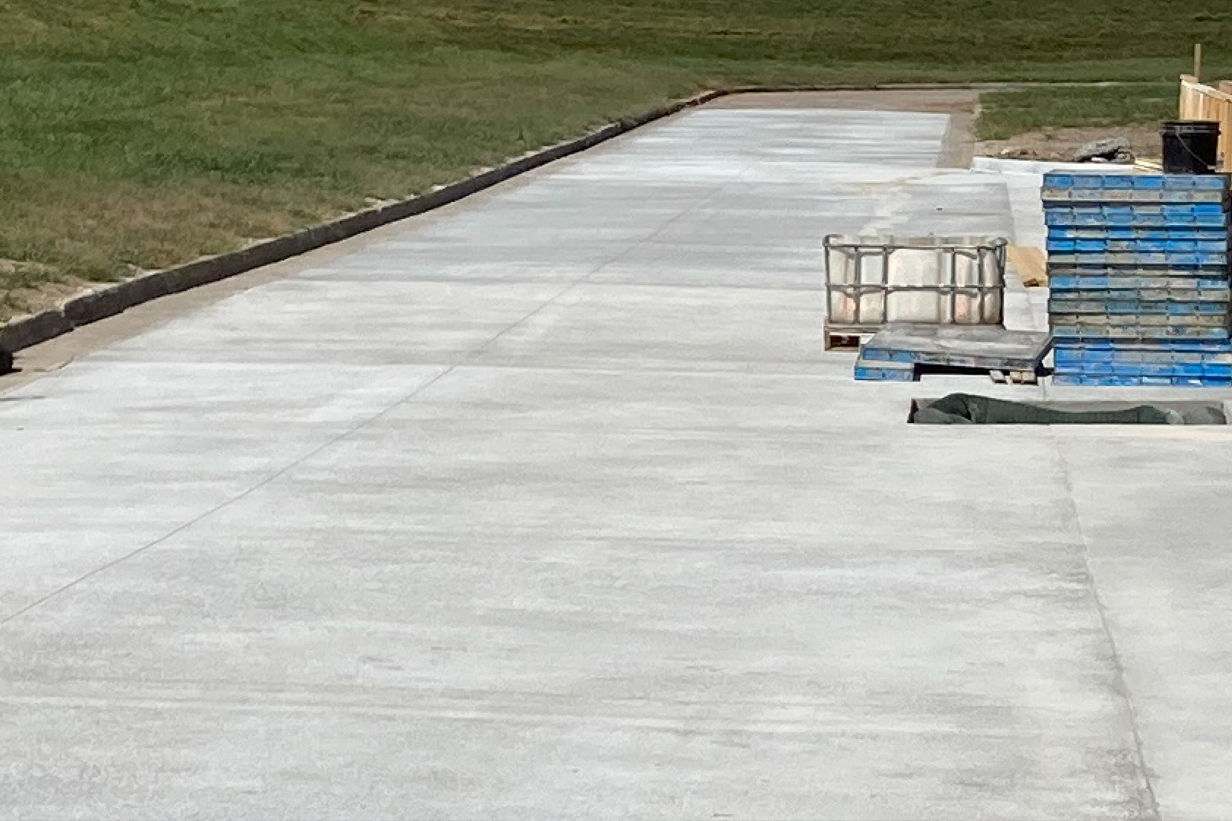 The road in front of the Chemical Building has been poured and is curing. The road was reconstructed to address stormwater issues.
