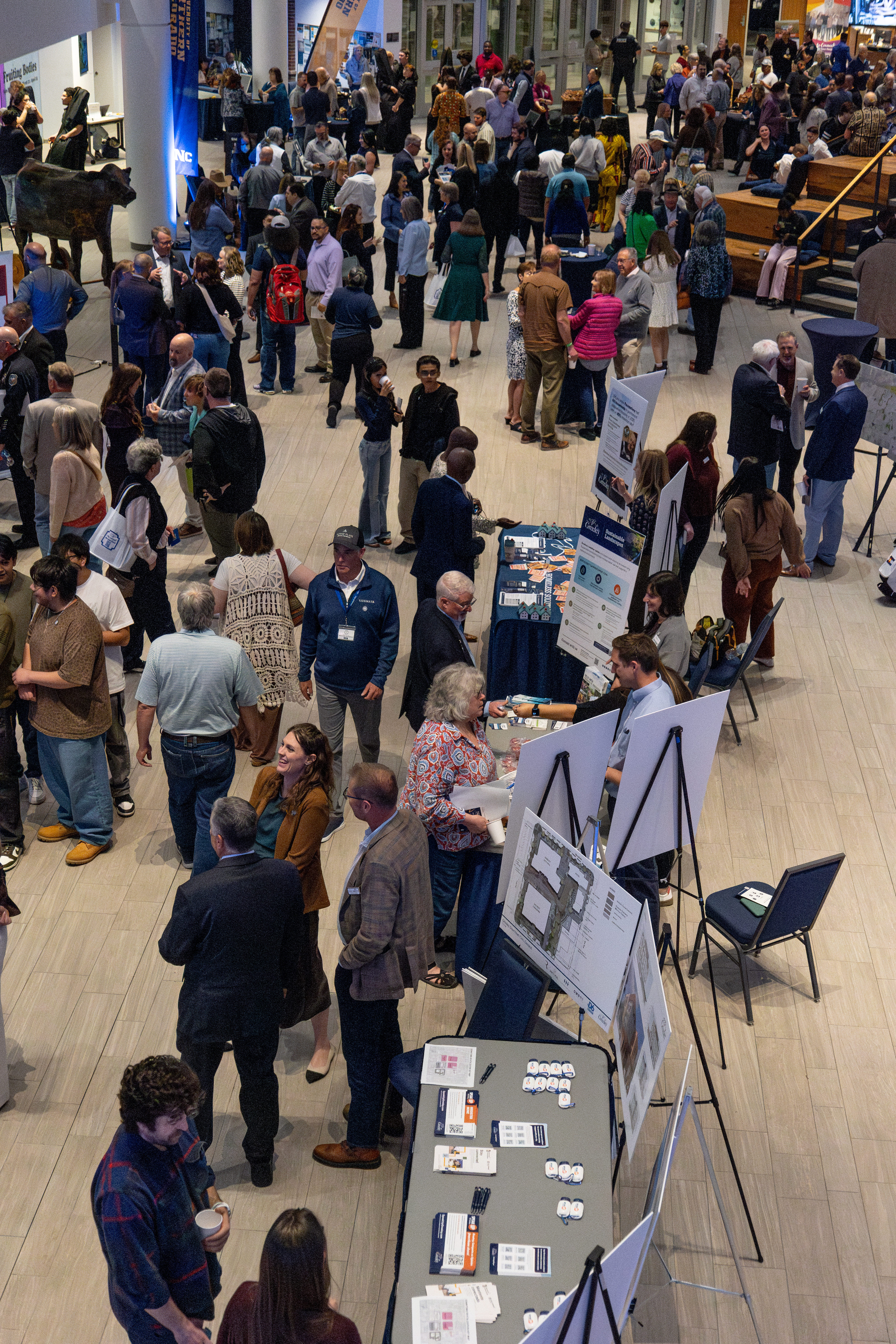 Aerial view of community members and attendees at the State of the City inside of University of Colorado's Campus Commons.