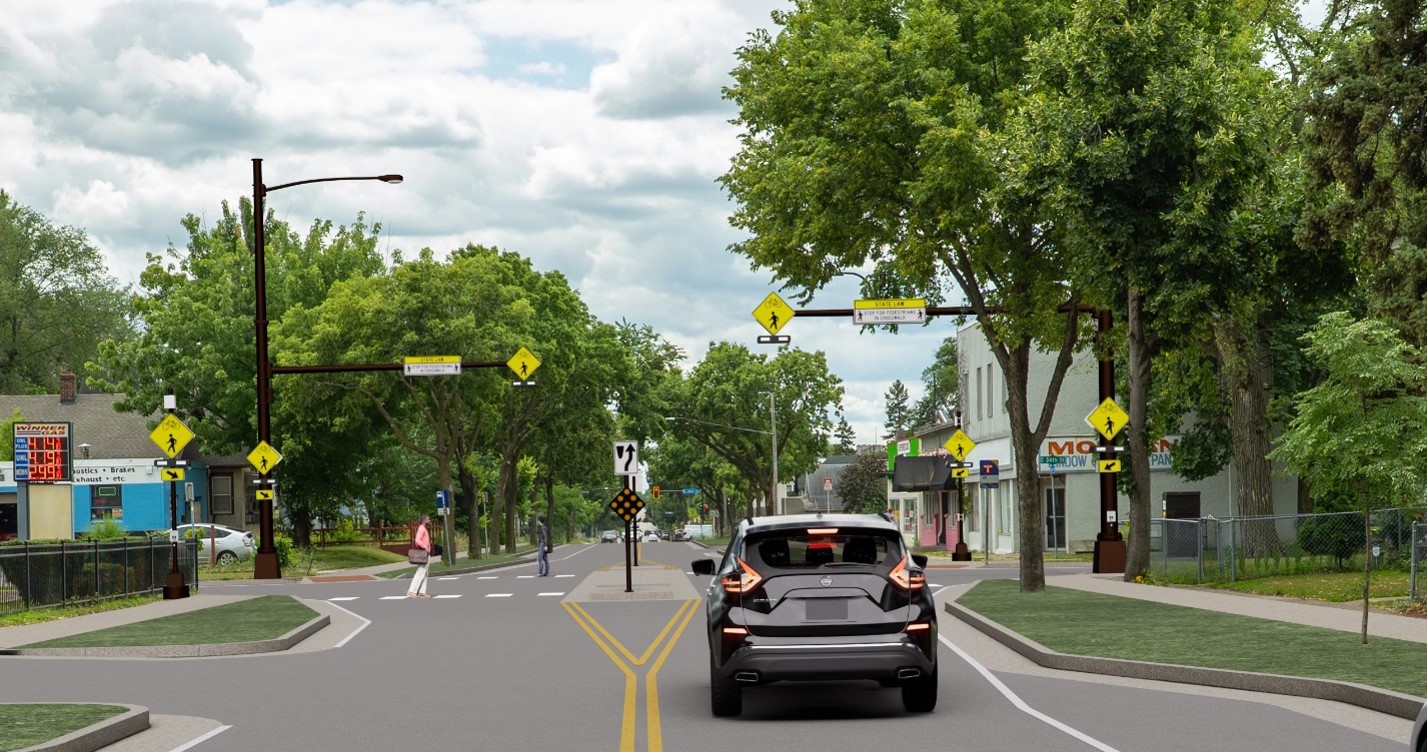 This rendering shows the intersection of Cedar Avenue and 34th Street with a right-out access intersection and a pedestrian flashing beacon above the intersection. Pedestrians are able to cross Cedar Avenue but cars cannot. Cars are prevented by a median from turning left onto Cedar Avenue. 