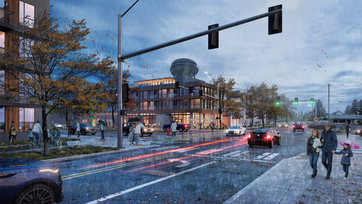 Rendering future development at the intersection of Mill Plain and Devine. Includes a three story building on the Fire Station parcel at the northwest corner of the intersection and a four story building on the southwest corner. Improvements to Devine will include a new, wider sidewalk and a two-way bikeway on the west side of the street. These new paths will connect to the new multi-use path on Devine between Idaho and 18th Street, which is scheduled for construction in 2021. There are people walking and biking and cars driving on the streets. The existing water tower is visible behind the new building on the Fire Station parcel.