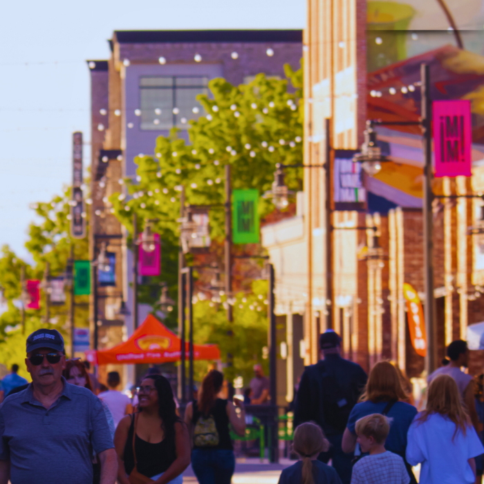 People walking with banners and buildings behind them