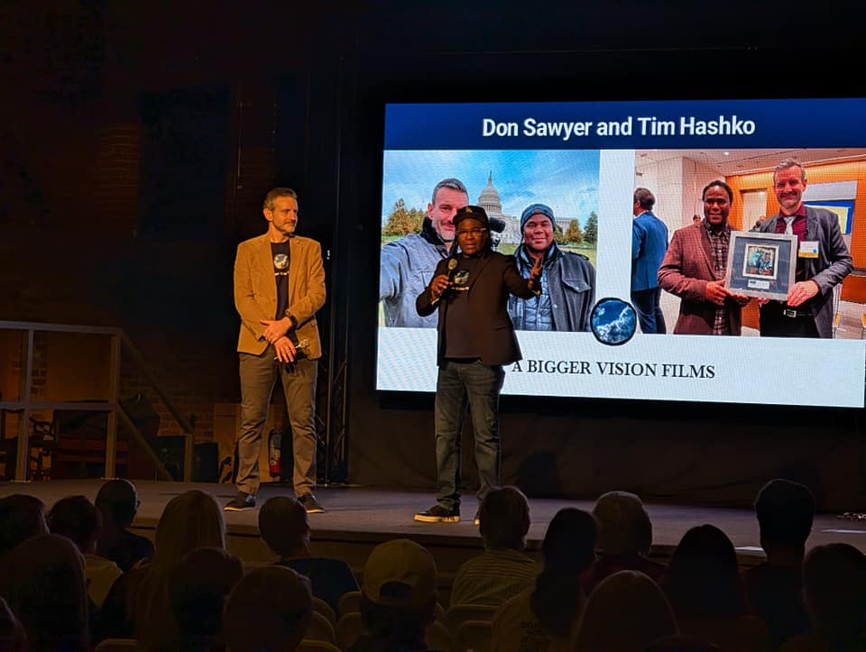 Film makers Don Sawyer and Tim Hashko speak to a crowd before the screening of their documentary.