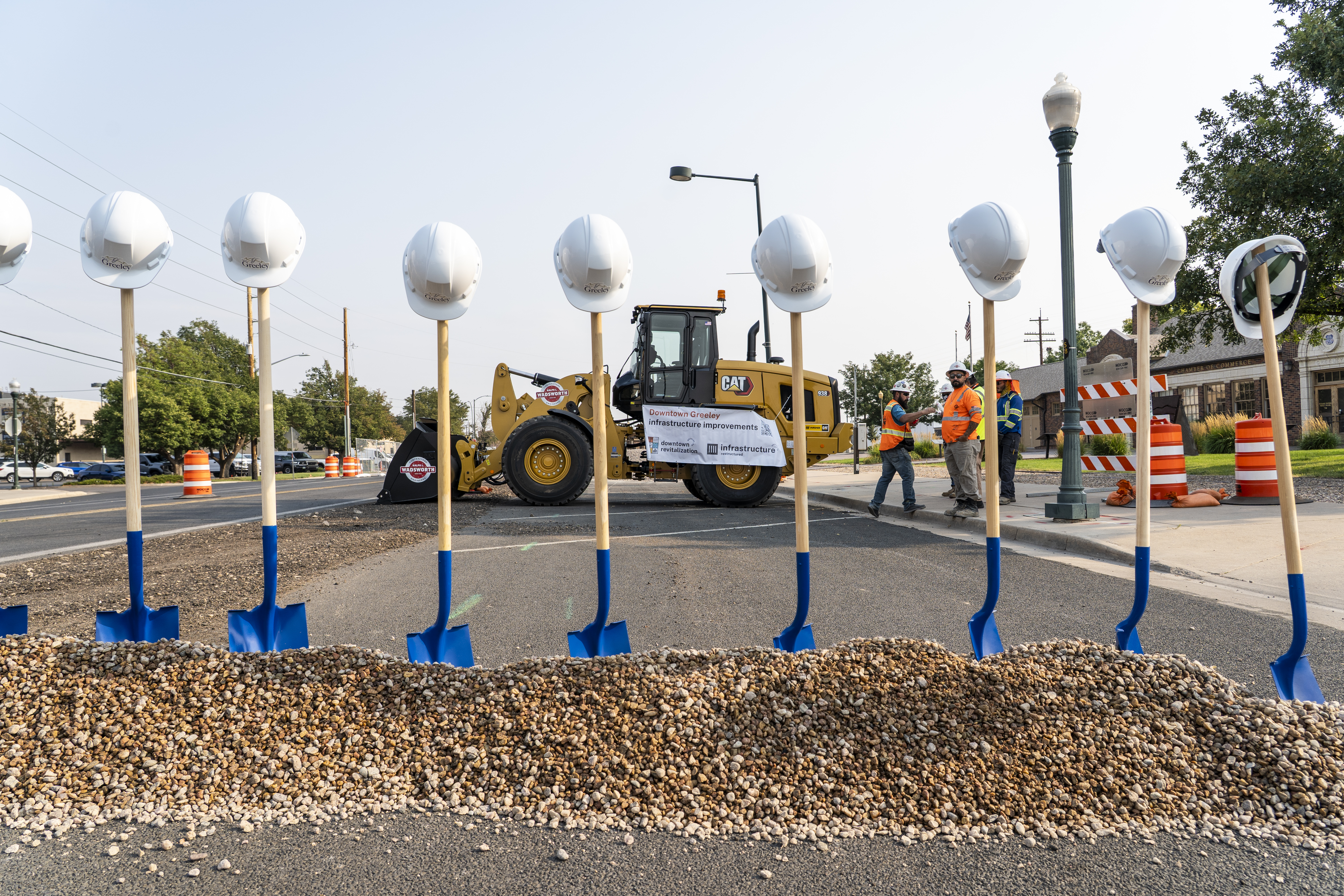 Ceremonial shovels with hard hats are staged before the ceremony.