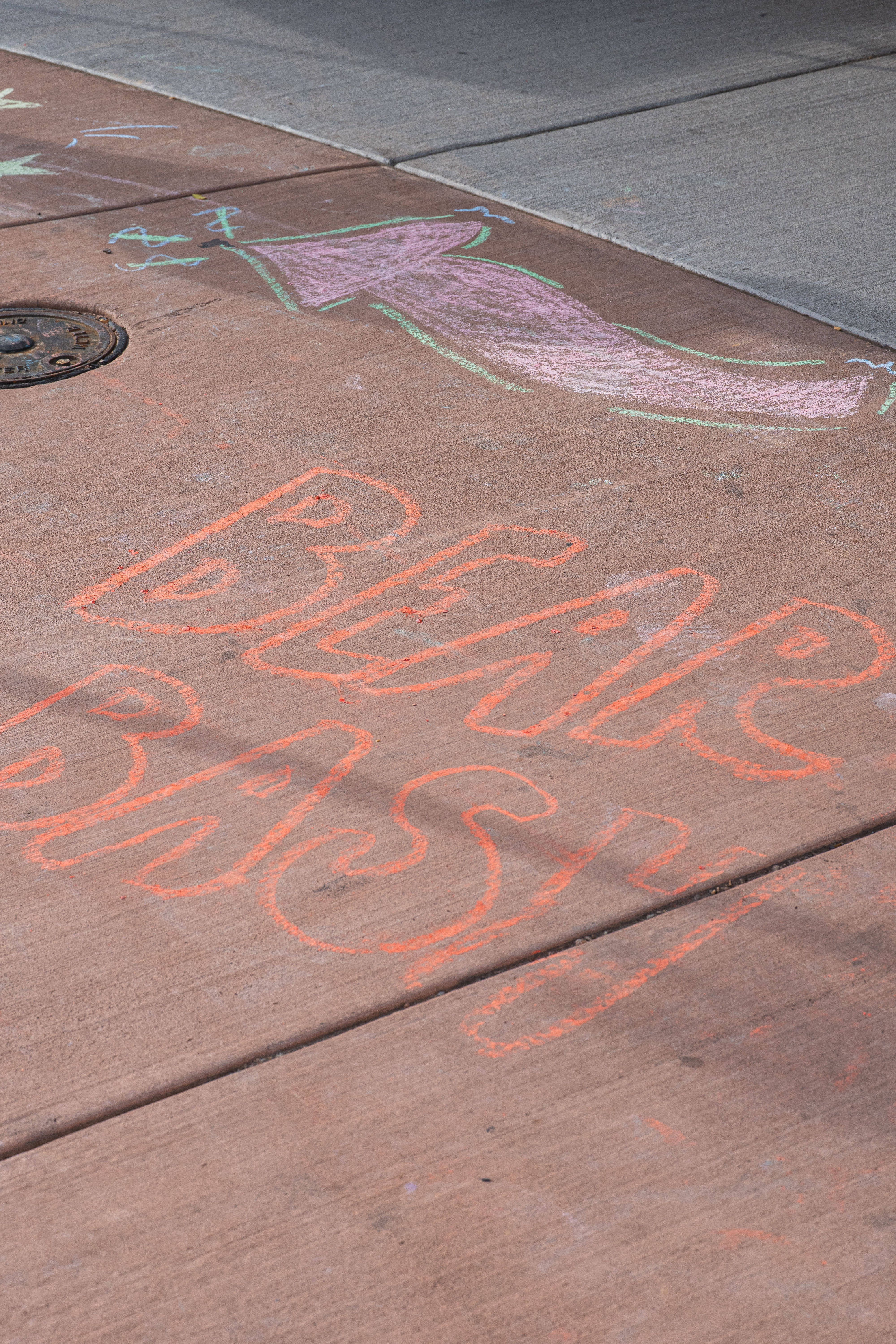 1. Colorful chalk art reading “Bear Bash” decorates a sidewalk.