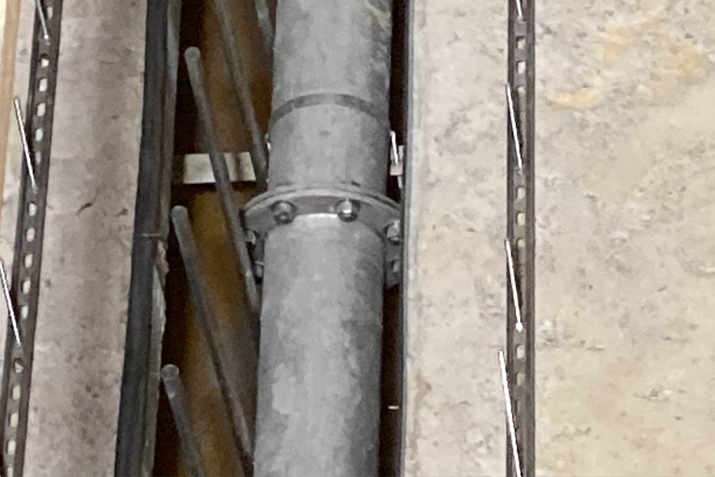 A worker double-checks the installation of a backwash pipe in Filter 6 in the Filter Building.