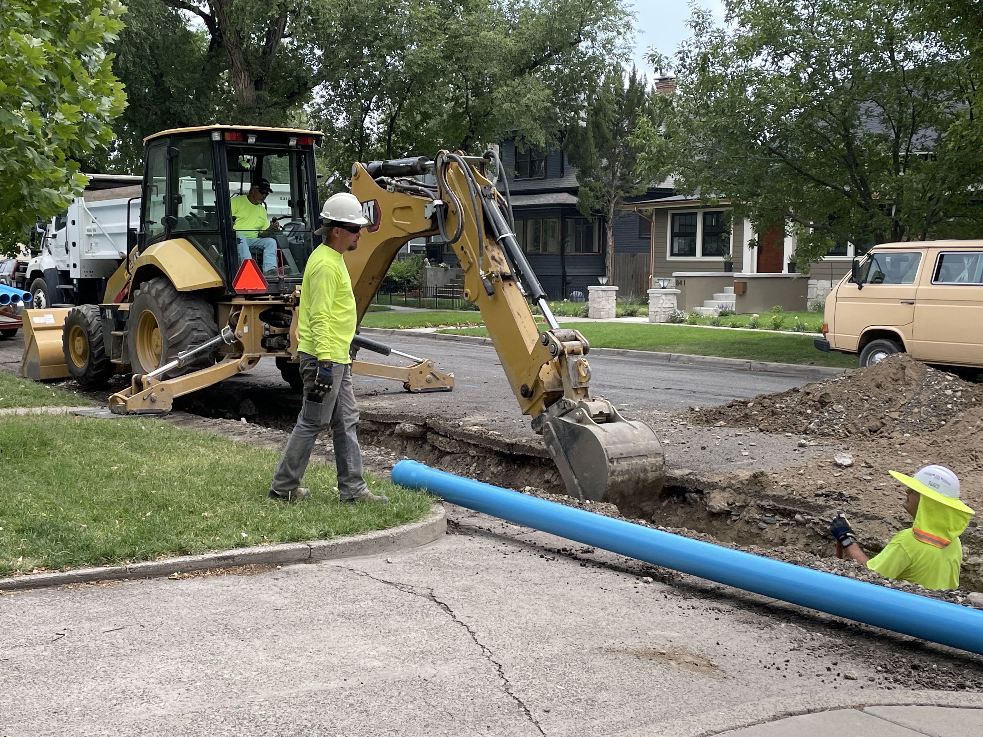 City crews work along Ouray Ave to replace the waterline