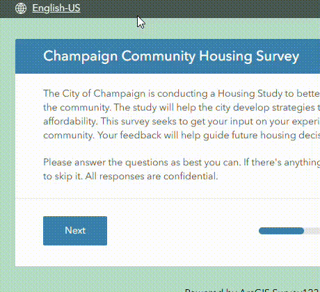 In the GIF, there is a language selector at the top left labeled “English-US.” The cursor moves up to this language menu and clicks it. When the menu opens, “Spanish (Español)” appears as one of the options. The user selects Spanish, and the survey interface immediately updates to reflect Spanish translation.