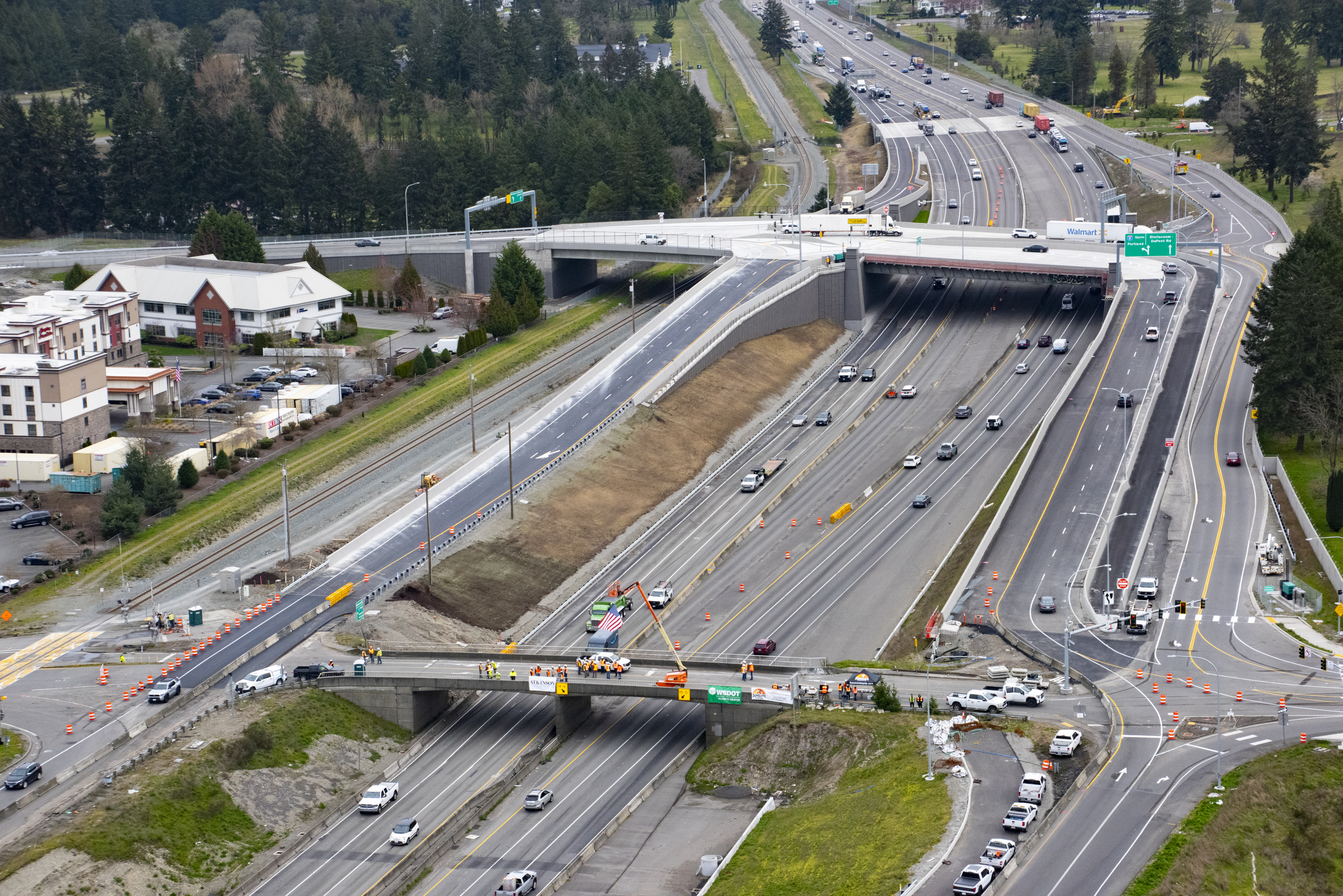 Two bridges span I-5 in DuPont. One at bottom of the photo is closed and scheduled for demolition and removal. The new bridge at the top of the photo spans both I-5 and the railroad, connecting JBLM, DuPont and I-5.