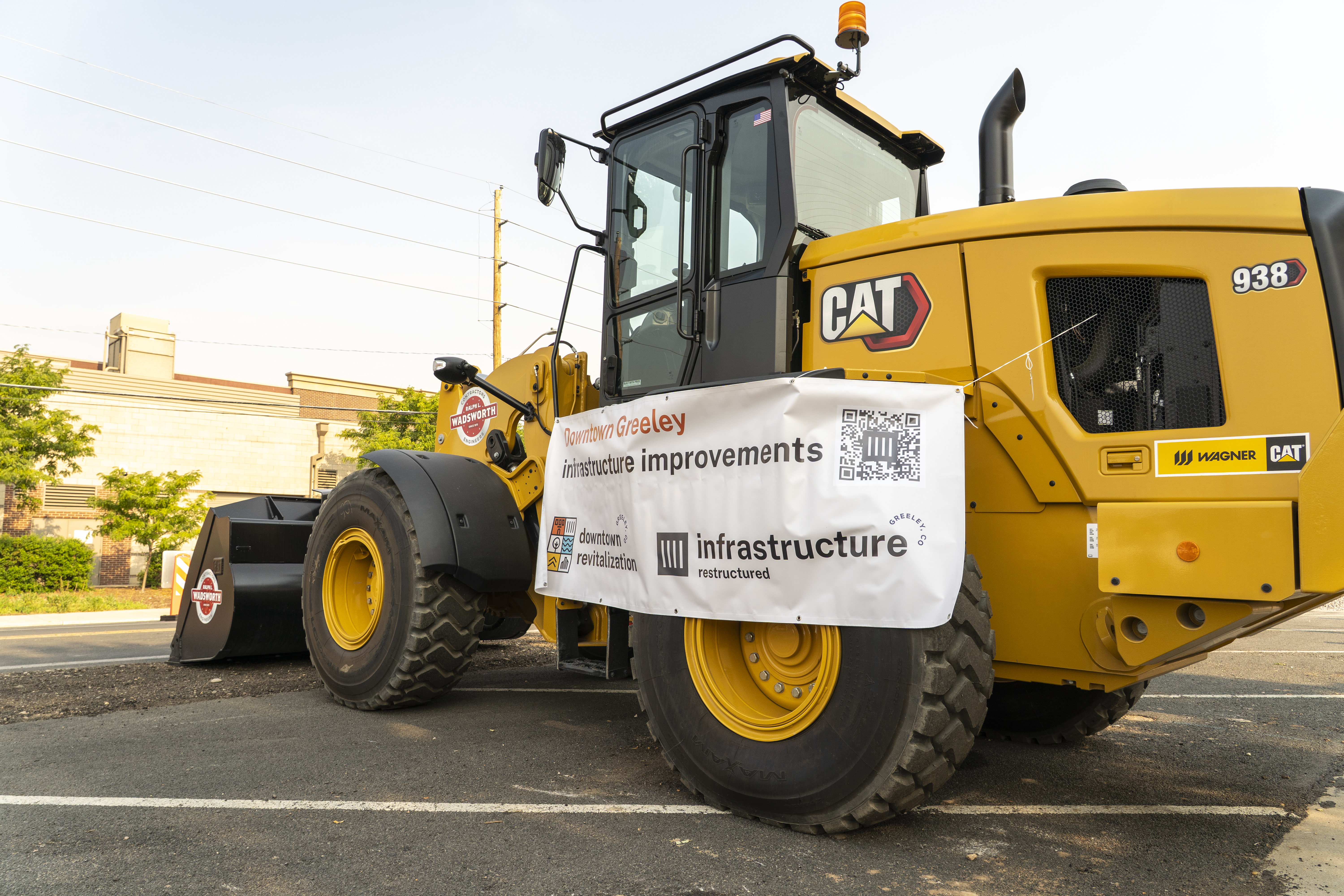 Heavy machinery with project banner.