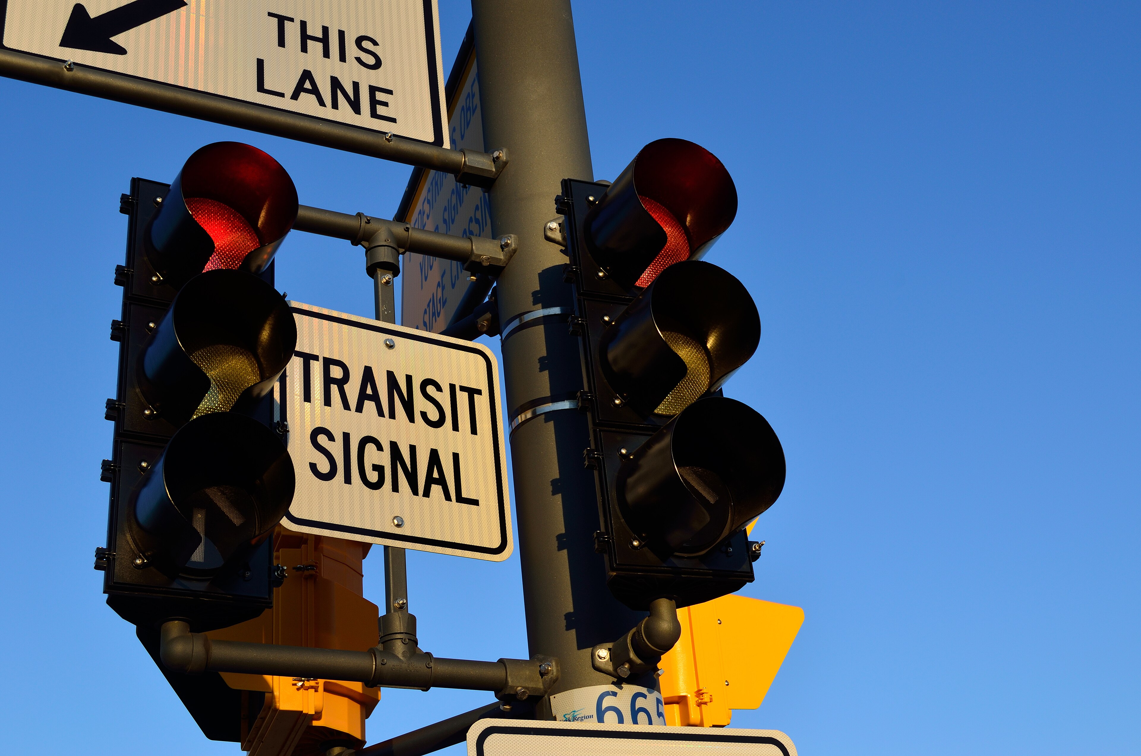  A transit signal mounted above an intersection helps buses move through traffic more efficiently while coordinating with other traffic signals.