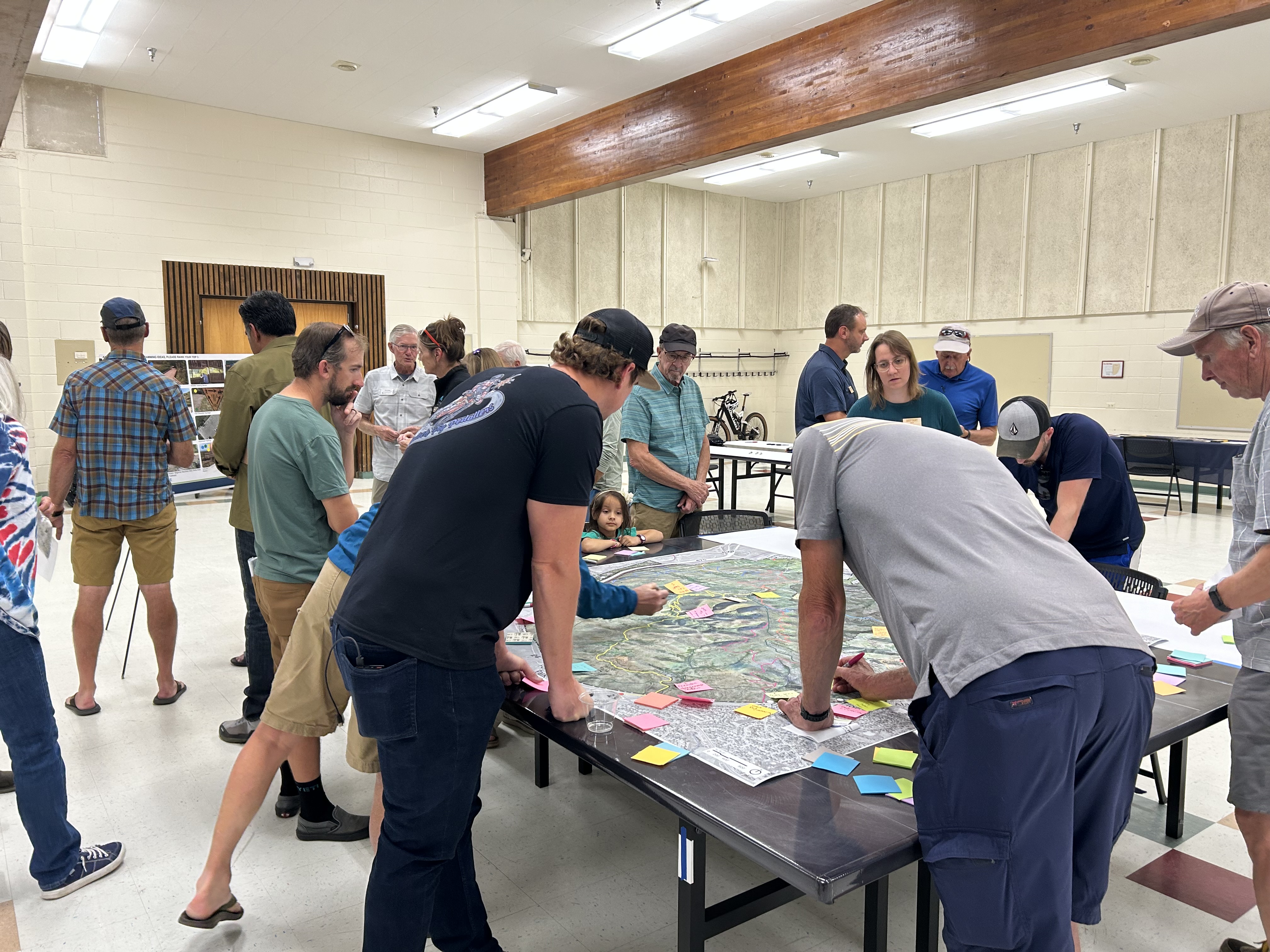 Photos of residents looking at a map during William F. Hayden Open House on Sept. 10. 