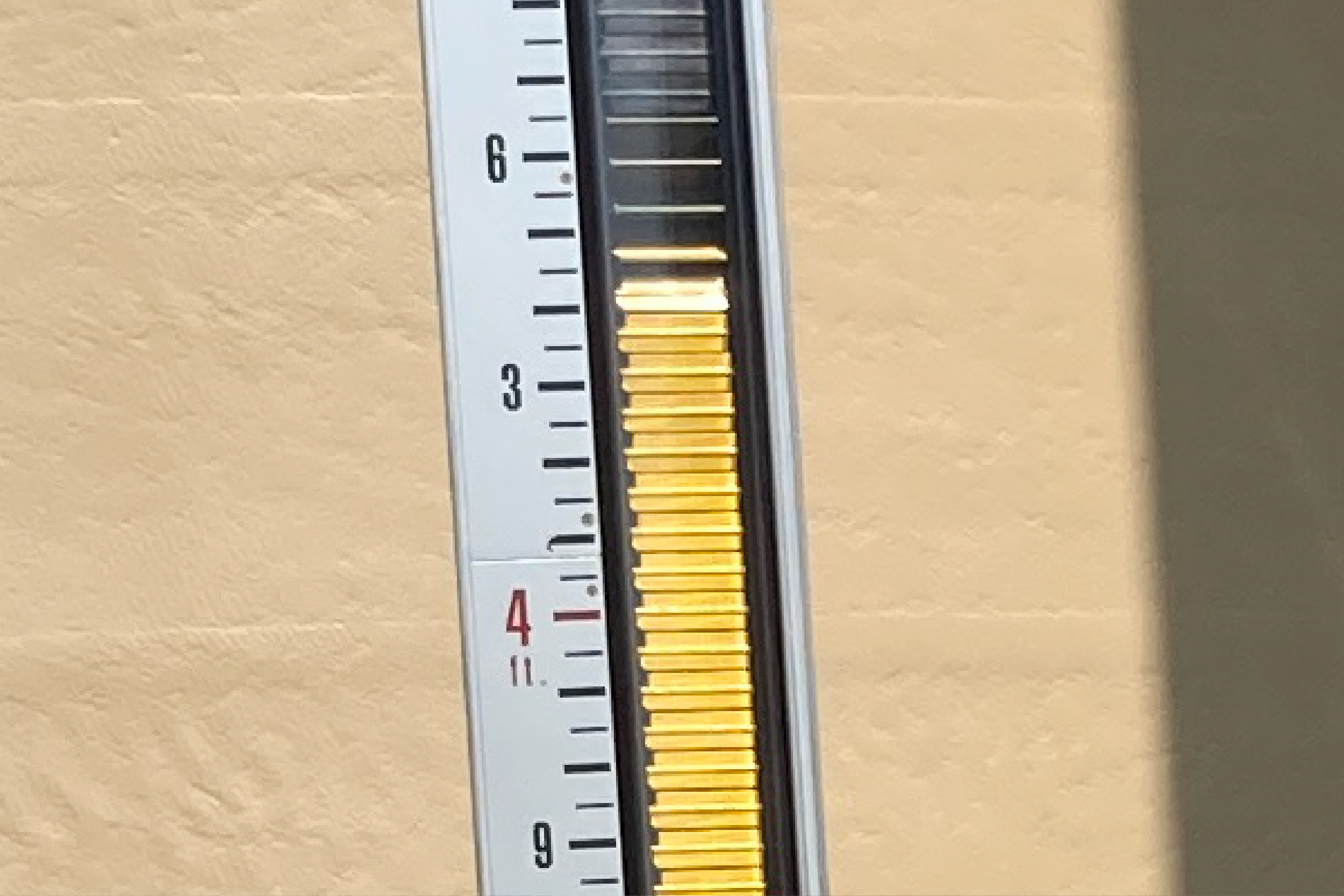 Yellow lines on the gauge give staff an idea of how much liquid ammonium sulfide remains in the tank.