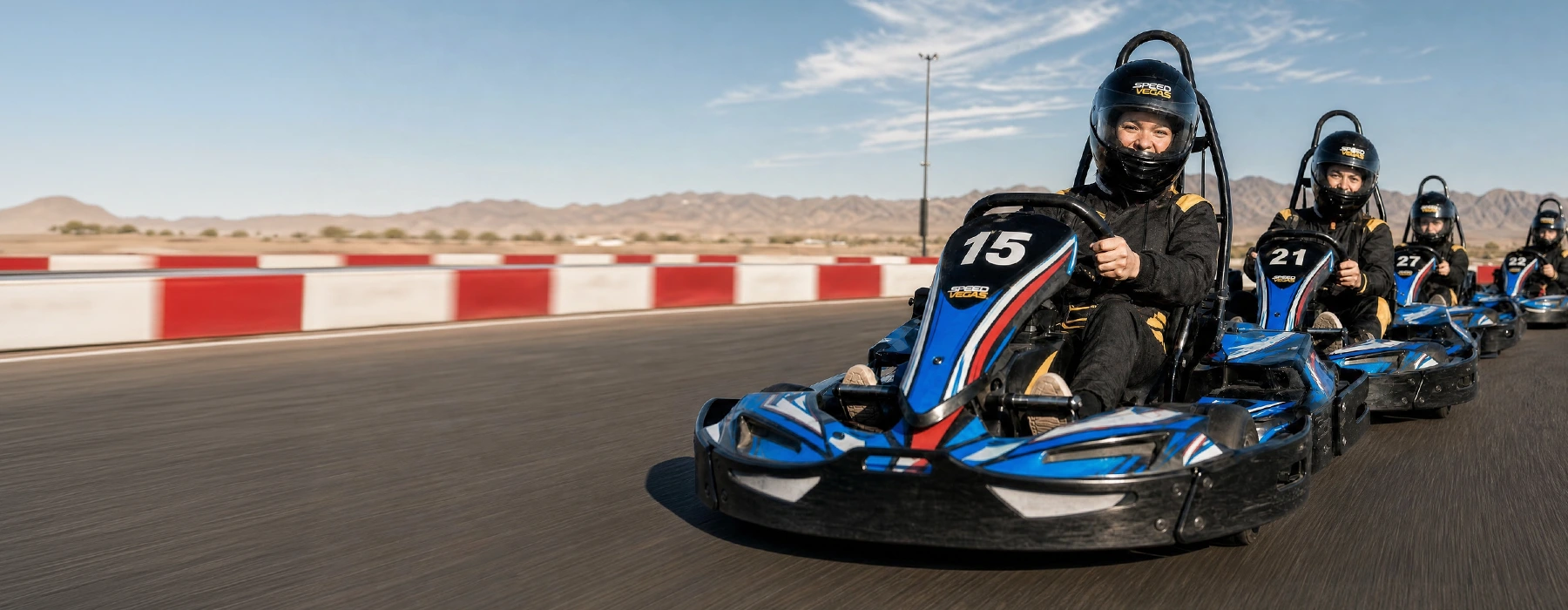 Go-karts racing at speed on the Vegas Superkarts outdoor track