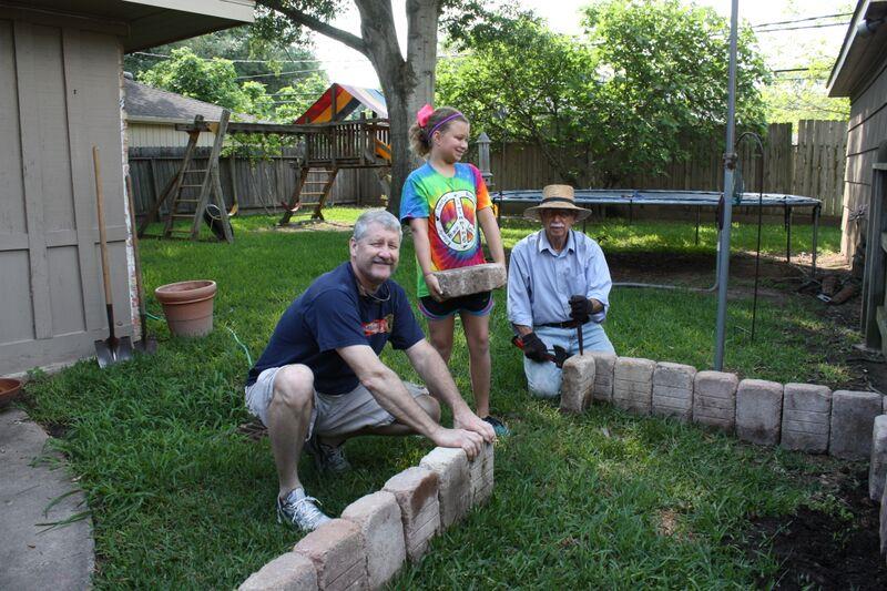 With son Ken Wright and granddaughter Rachel constructing Rachel's vegetable garden. 