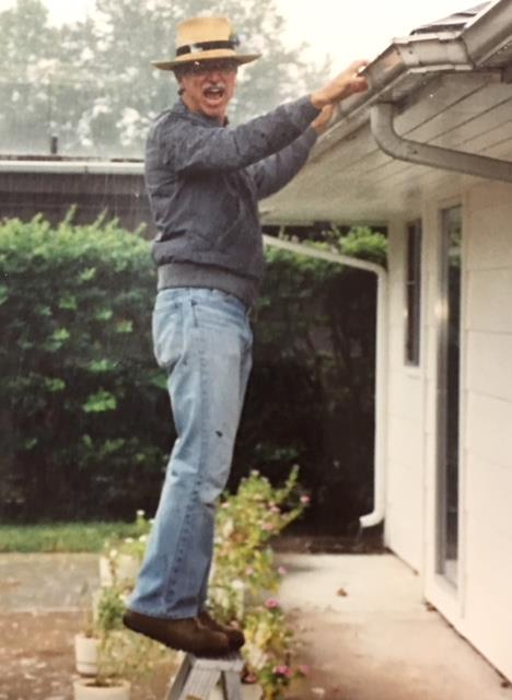Cleaning gutters.....in the rain, of course. He said that's when he could tell how they were working