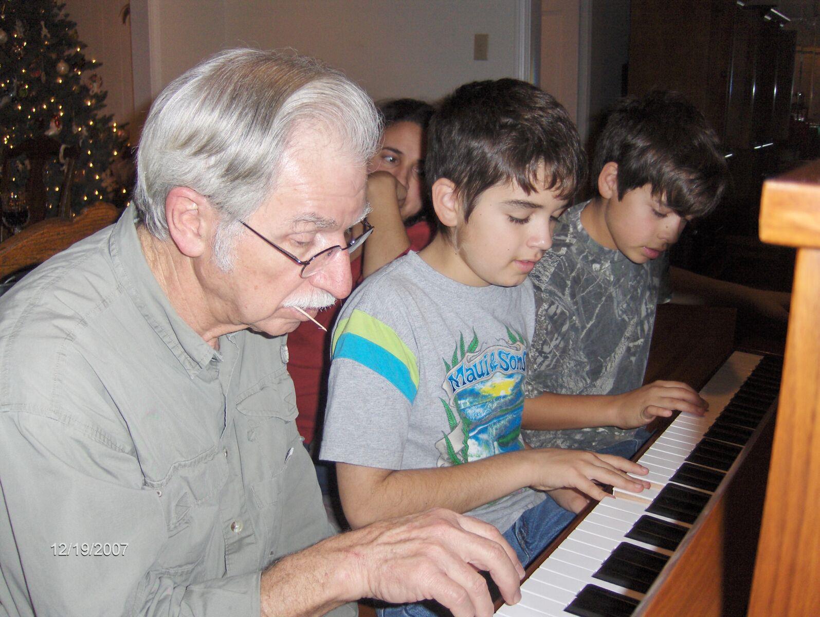 Never happier than at a piano, here with Sam and Nathan, 2007