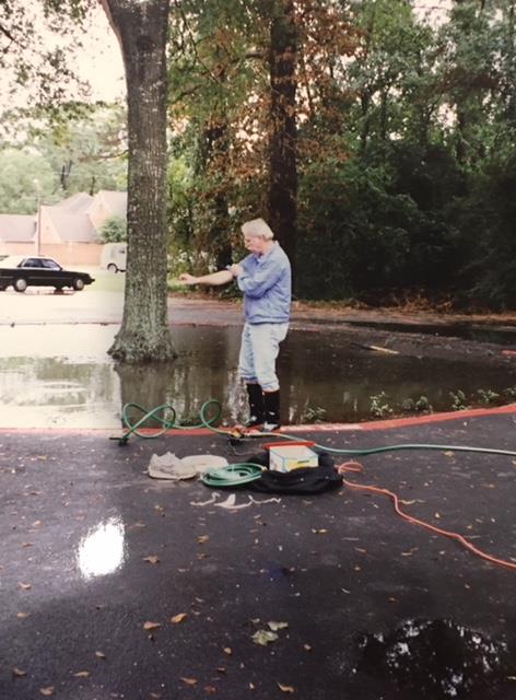 Pumping rain water from large oak tree, Monarch School on Wirt Road. He did this MANY times. 