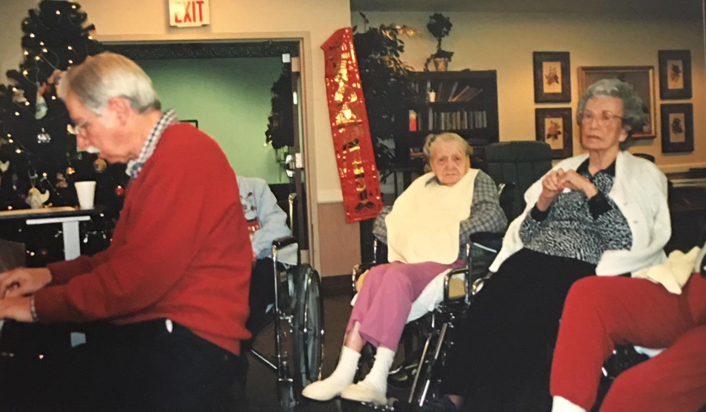 Playing piano for residents at University Place Nursing Center, Christmas Day 2000