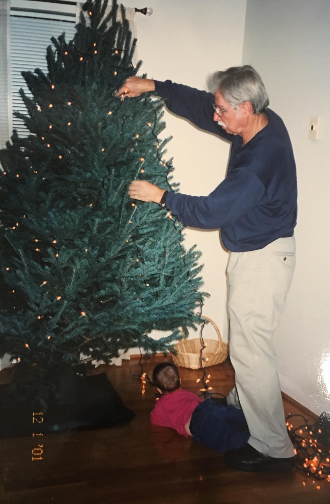 Trimming the tree. Notice the little helper, Rachel Wright, age 8 months