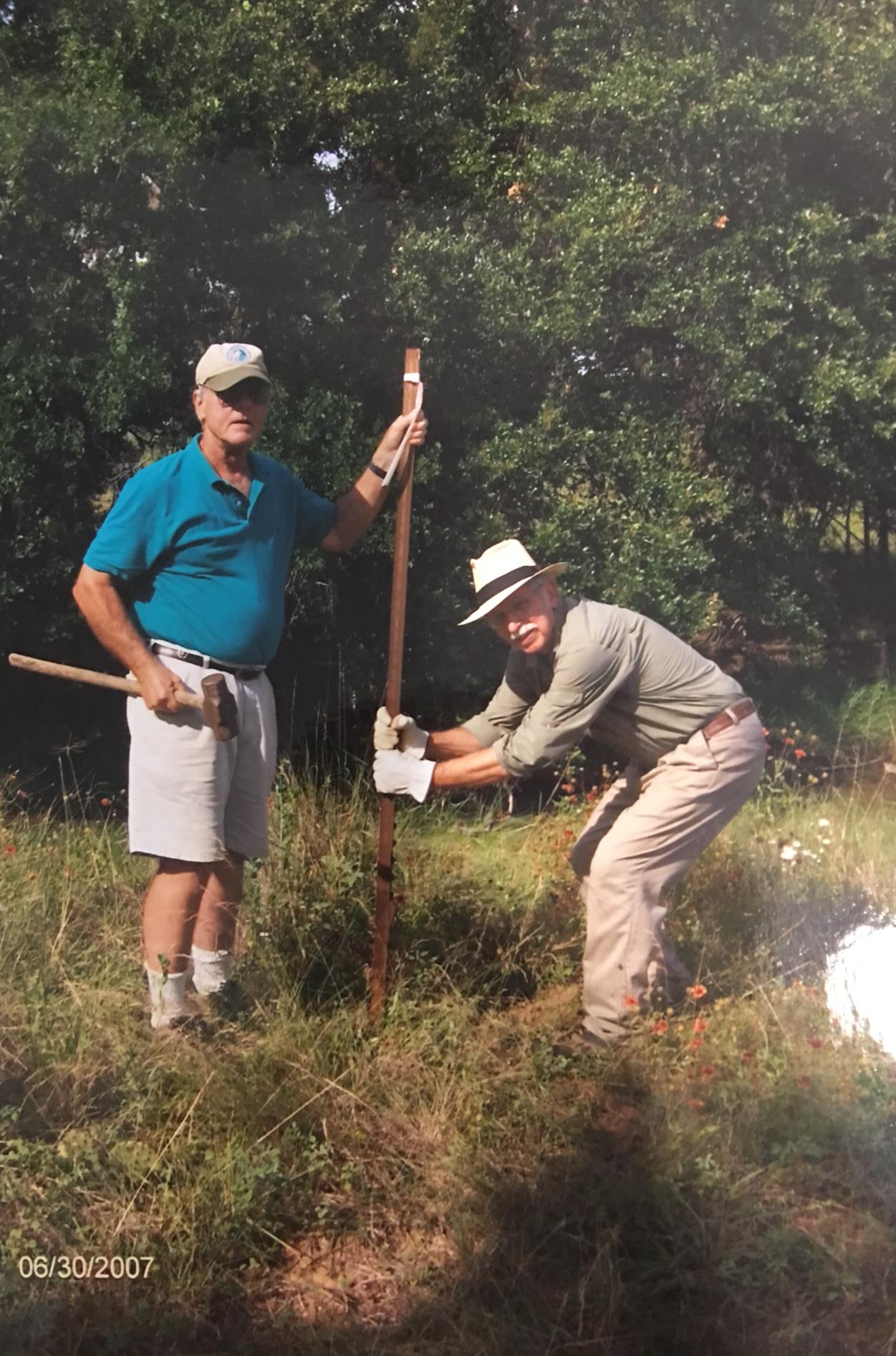 Staking out a new vegetable garden at Harris and Romelia's "Hog Heaven" in Johnson City, 2007