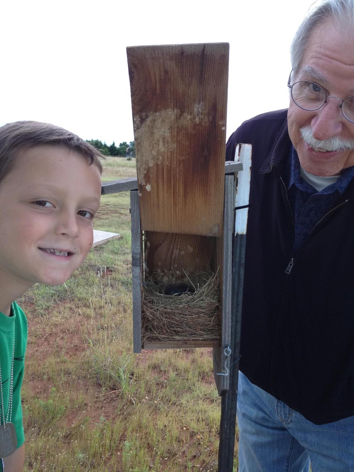 Checking the bluebird house with grandson Grant Rudolph, 2012