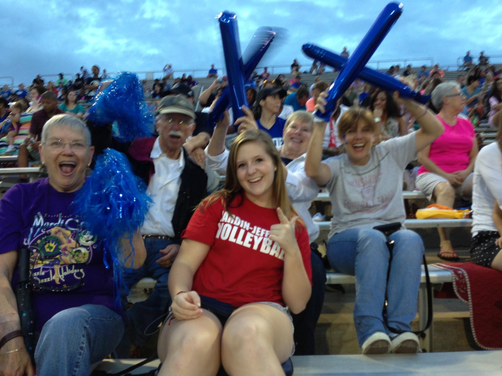 Webb family cheering on Nathan Webb at high school football game, 2012